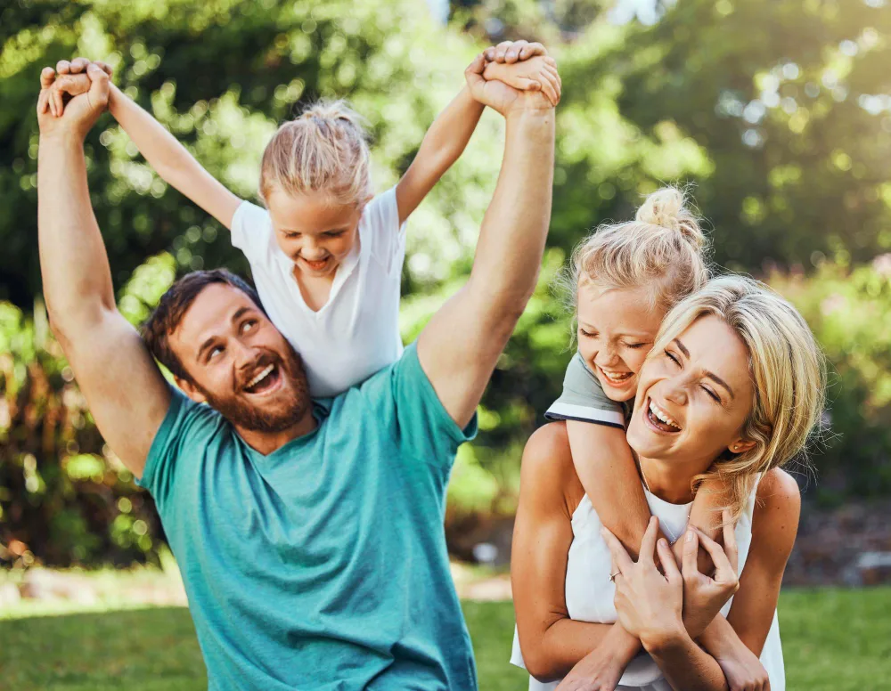 Happy family playing outdoors